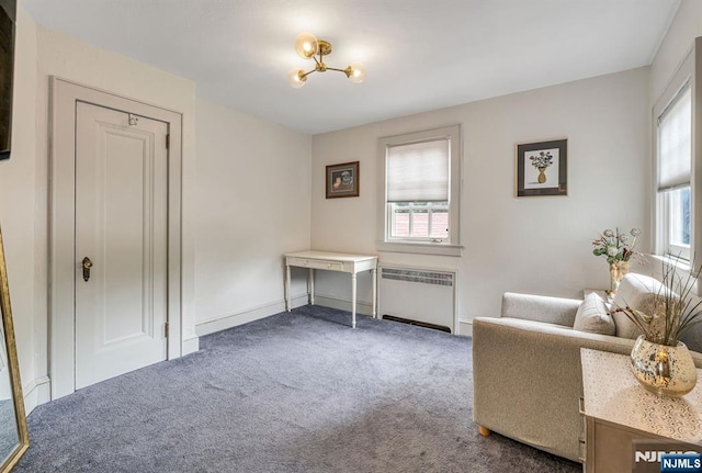 518 Standish Rd, Teaneck, NJ 07666 - sitting room featuring radiator, carpet flooring, and a chandelier