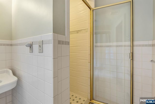 518 Standish Rd, Teaneck, NJ 07666 - full bathroom with tile walls, a shower stall, and wainscoting
