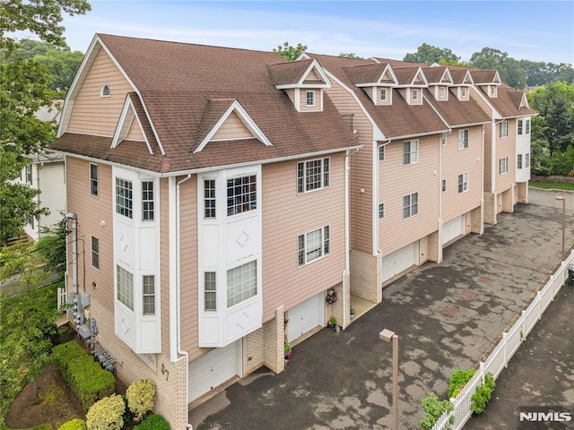 87 Centre St Unit 2, Nutley, NJ 07110 - view of property exterior with a shingled roof