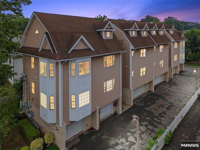 87 Centre St Unit 2, Nutley, NJ 07110 - property exterior at dusk with roof with shingles