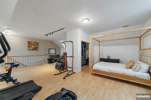 87 Centre St Unit 2, Nutley, NJ 07110 - bedroom featuring wood finished floors, track lighting, a spacious closet, and a closet