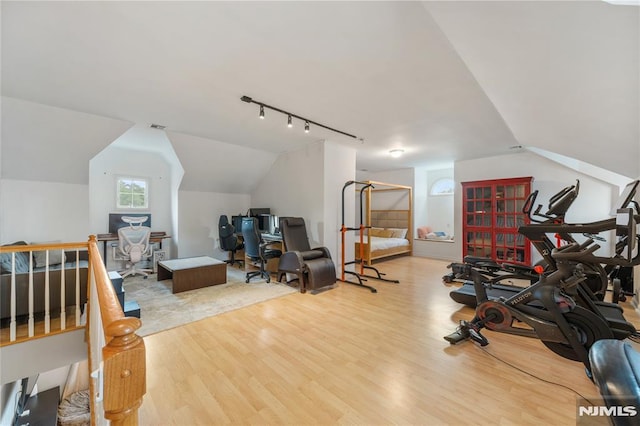 87 Centre St Unit 2, Nutley, NJ 07110 - workout area featuring wood finished floors, vaulted ceiling, and track lighting