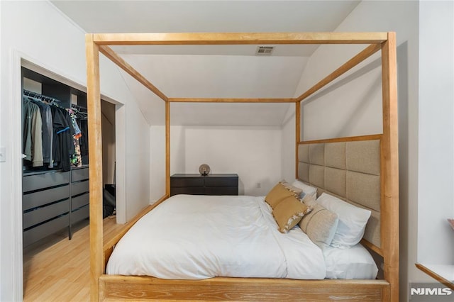 87 Centre St Unit 2, Nutley, NJ 07110 - bedroom with wood finished floors, vaulted ceiling, and a closet