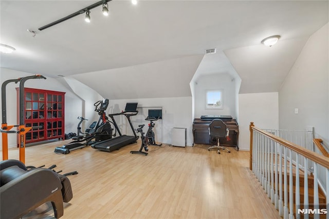87 Centre St Unit 2, Nutley, NJ 07110 - exercise area featuring wood finished floors, vaulted ceiling, and rail lighting