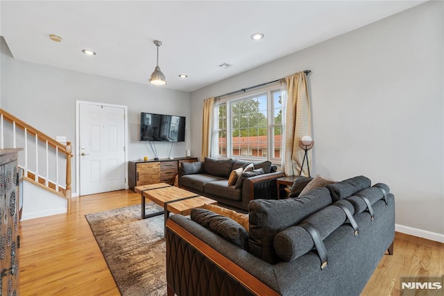 87 Centre St Unit 2, Nutley, NJ 07110 - living area with stairs, light wood finished floors, and recessed lighting