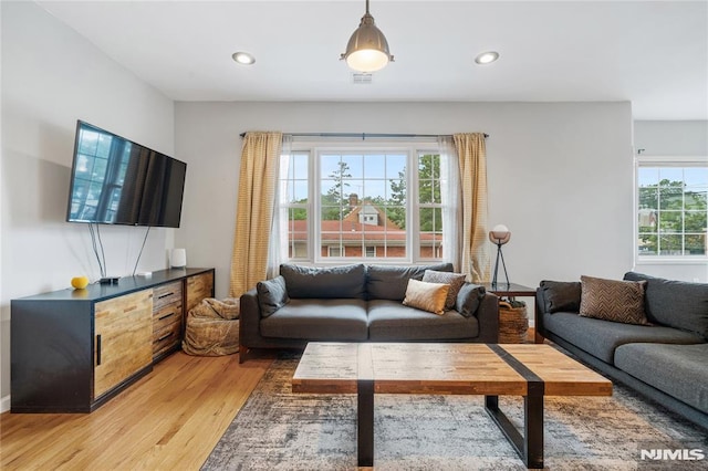 87 Centre St Unit 2, Nutley, NJ 07110 - living room with light wood finished floors and recessed lighting