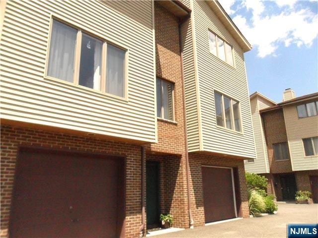 34 Piermont Rd Unit 3, Tenafly, NJ 07670 - view of building exterior with a garage