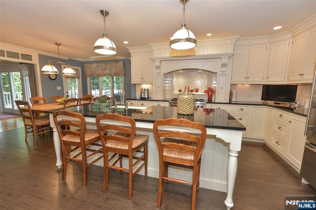 581 Eder Ave, Wyckoff, NJ 07481 - kitchen with dark countertops, dark wood-type flooring, decorative backsplash, hanging light fixtures, and recessed lighting