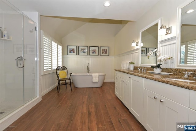 581 Eder Ave, Wyckoff, NJ 07481 - full bath with a shower stall, double vanity, wainscoting, wood finished floors, and healthy amount of natural light