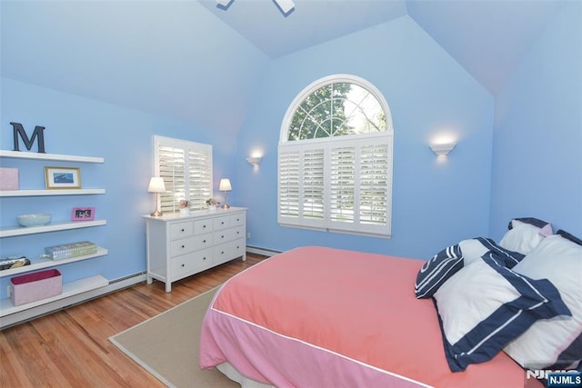 581 Eder Ave, Wyckoff, NJ 07481 - bedroom with vaulted ceiling, a baseboard radiator, and wood finished floors