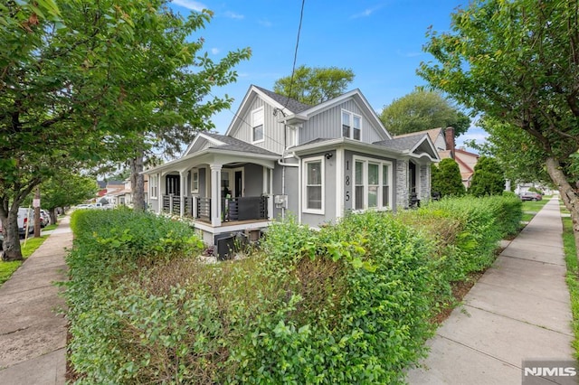 36 Kent, Newark, NJ 07108 - view of home's exterior featuring covered porch, a shingled roof, and stucco siding