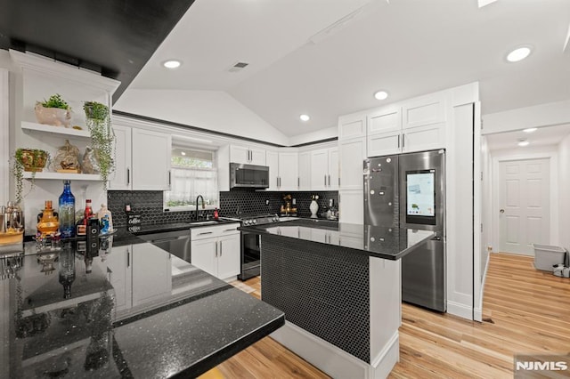 36 Kent, Newark, NJ 07108 - kitchen with stainless steel appliances, open shelves, light wood finished floors, lofted ceiling, and dark stone counters