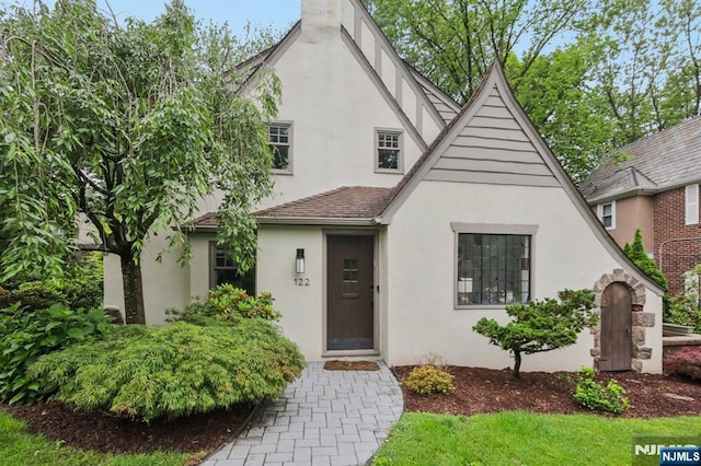122 Howard Ter, Leonia, NJ 07605 - tudor house with stucco siding and a shingled roof