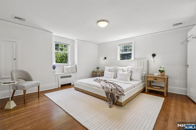 122 Howard Ter, Leonia, NJ 07605 - bedroom with radiator heating unit, wood finished floors, and ornamental molding