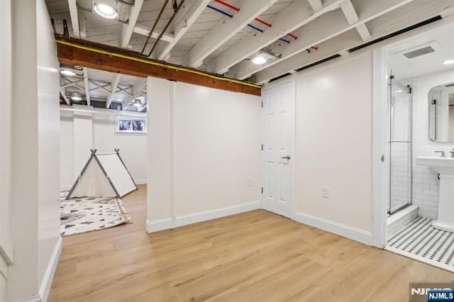 122 Howard Ter, Leonia, NJ 07605 - finished below grade area with wood finished floors and baseboards