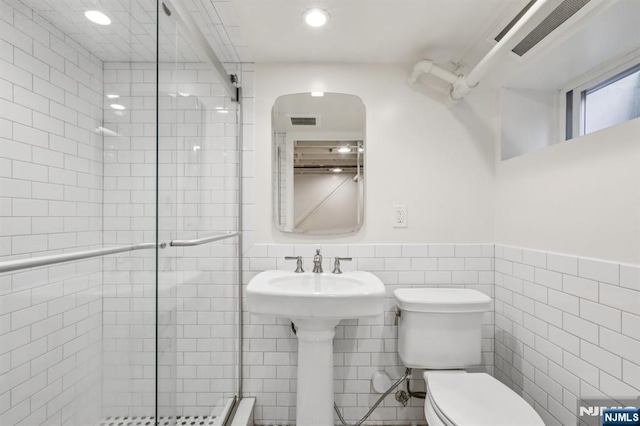 122 Howard Ter, Leonia, NJ 07605 - full bath featuring a stall shower, tile walls, recessed lighting, and a wainscoted wall