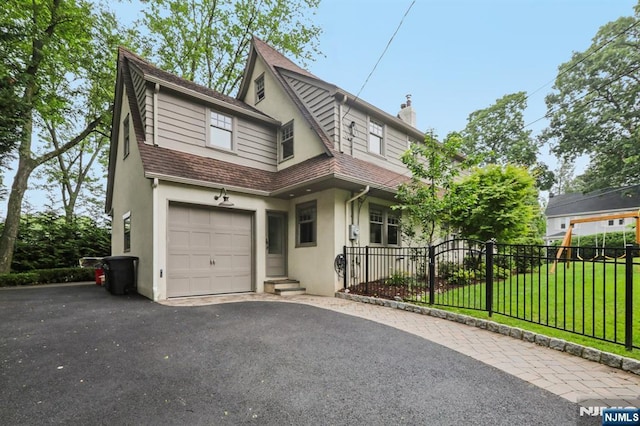 122 Howard Ter, Leonia, NJ 07605 - view of front of house with stucco siding, driveway, a chimney, and roof with shingles