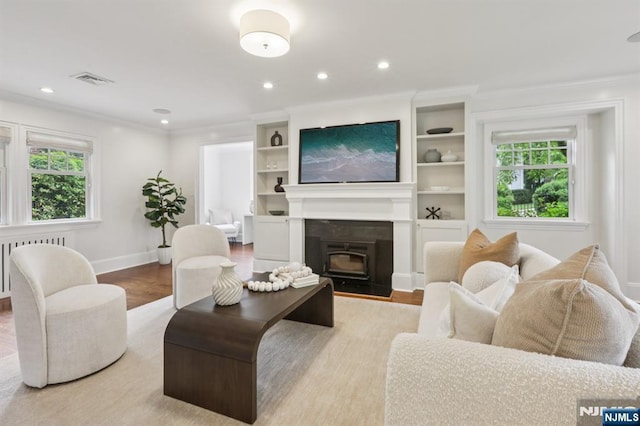 122 Howard Ter, Leonia, NJ 07605 - living room featuring ornamental molding, wood finished floors, recessed lighting, and radiator heating unit