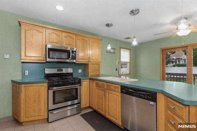 59 Parkview Ave, Elmwood Park, NJ 07407 - kitchen featuring stainless steel appliances, a peninsula, light tile patterned flooring, pendant lighting, and ceiling fan