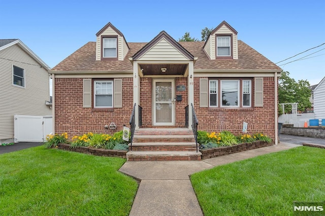 59 Parkview Ave, Elmwood Park, NJ 07407 - view of front of house with brick siding and a shingled roof