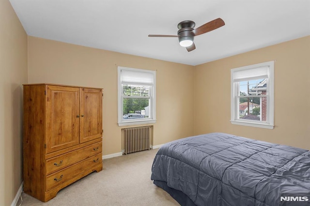 59 Parkview Ave, Elmwood Park, NJ 07407 - bedroom with radiator, light colored carpet, and a ceiling fan