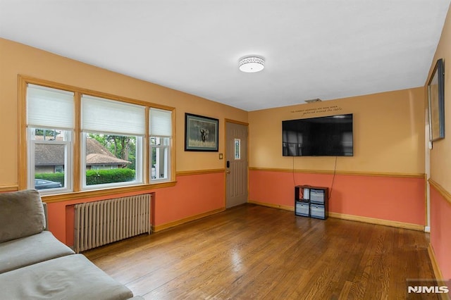 59 Parkview Ave, Elmwood Park, NJ 07407 - unfurnished living room with radiator and wood finished floors