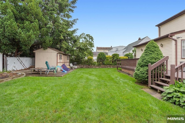 59 Parkview Ave, Elmwood Park, NJ 07407 - fenced backyard with a storage unit