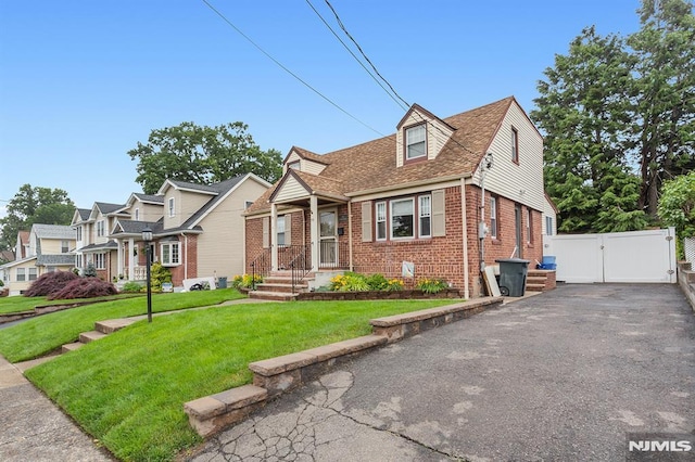 59 Parkview Ave, Elmwood Park, NJ 07407 - view of front of home with a gate and brick siding