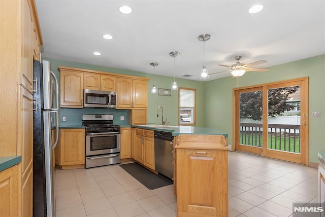 59 Parkview Ave, Elmwood Park, NJ 07407 - kitchen featuring stainless steel appliances, a peninsula, ceiling fan, recessed lighting, and decorative light fixtures