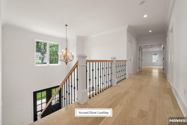 22 Northwood Ave, Demarest, NJ 07627 - corridor with a chandelier, wood finished floors, recessed lighting, crown molding, and an upstairs landing