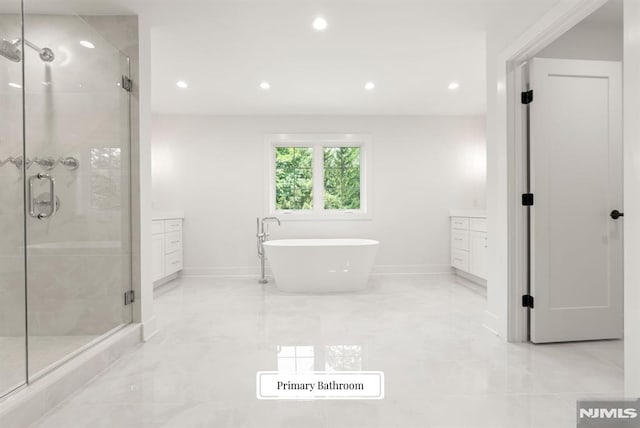 22 Northwood Ave, Demarest, NJ 07627 - bathroom with a stall shower, vanity, recessed lighting, a soaking tub, and marble finish floors