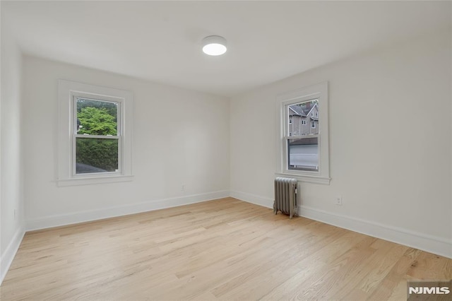 115 Wilson Ave, Rutherford, NJ 07070 - empty room featuring radiator and wood finished floors