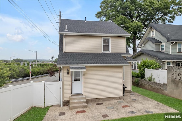 115 Wilson Ave, Rutherford, NJ 07070 - rear view of property with a gate, roof with shingles, and a patio