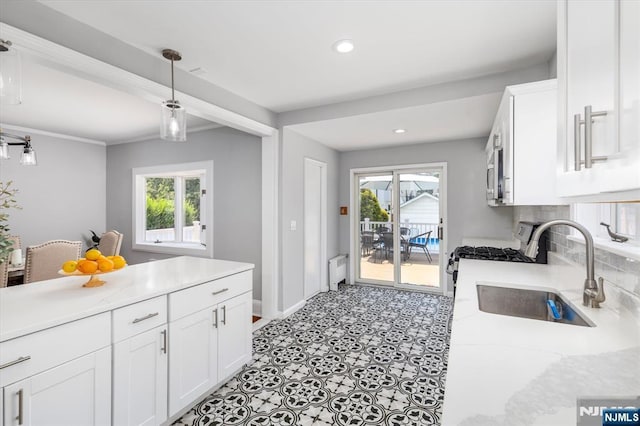 188 Wheaton Pl, Rutherford, NJ 07070 - kitchen featuring gas range oven, white cabinetry, healthy amount of natural light, decorative light fixtures, and recessed lighting