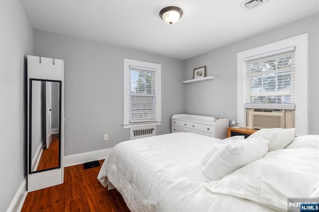 188 Wheaton Pl, Rutherford, NJ 07070 - bedroom with wood finished floors, cooling unit, and radiator