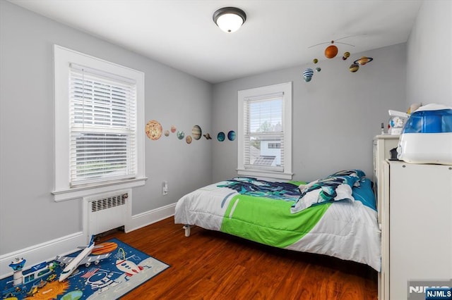 188 Wheaton Pl, Rutherford, NJ 07070 - bedroom with radiator heating unit and wood finished floors