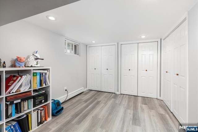 188 Wheaton Pl, Rutherford, NJ 07070 - unfurnished bedroom with baseboard heating, wood finished floors, multiple closets, and recessed lighting