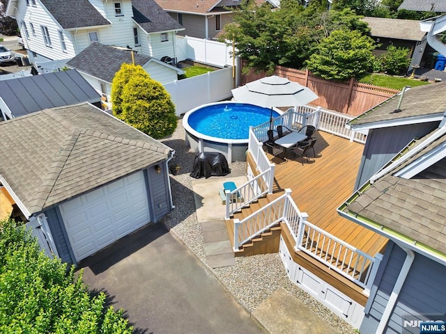 188 Wheaton Pl, Rutherford, NJ 07070 - view of swimming pool with a deck, outdoor dining space, a fenced backyard, and a residential view