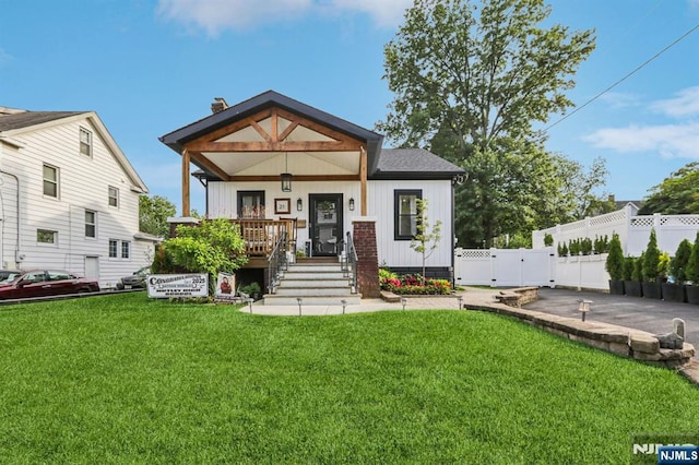 21 Mountainview Ave, Nutley, NJ 07110 - view of front of property featuring a porch, a gate, and a chimney