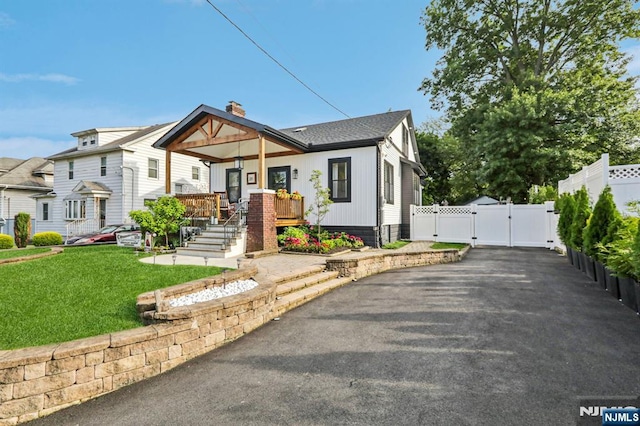 21 Mountainview Ave, Nutley, NJ 07110 - view of front of home with a gate, covered porch, and driveway