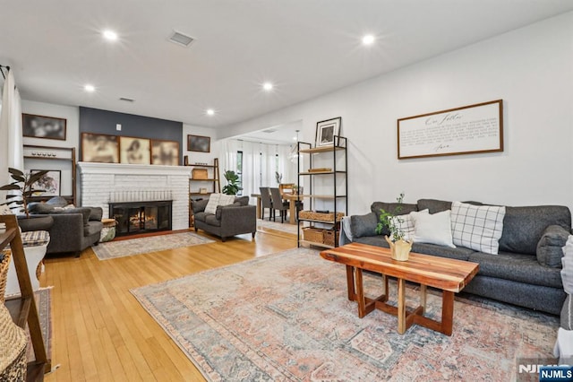 21 Mountainview Ave, Nutley, NJ 07110 - living room featuring a brick fireplace, light wood-type flooring, and recessed lighting