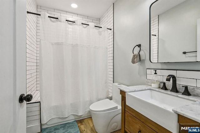 21 Mountainview Ave, Nutley, NJ 07110 - full bathroom featuring vanity, tasteful backsplash, shower / tub combo, wood finished floors, and recessed lighting