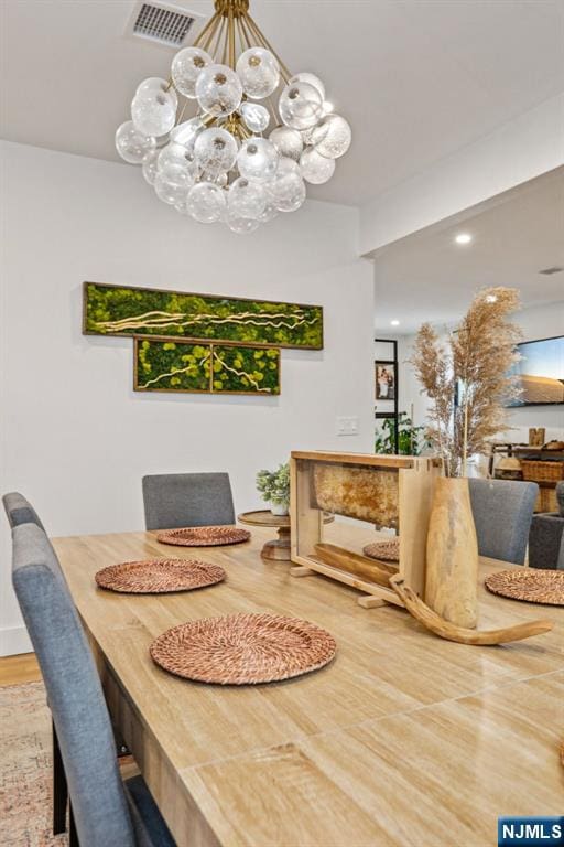 21 Mountainview Ave, Nutley, NJ 07110 - dining area featuring a chandelier and wood finished floors