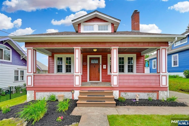 74 Bartholdi Ave, Butler Borough, NJ 07405 - bungalow-style house with covered porch, a chimney, and a shingled roof