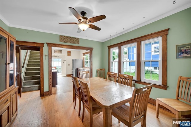 74 Bartholdi Ave, Butler Borough, NJ 07405 - dining area featuring light wood-style flooring, a ceiling fan, stairs, and ornamental molding