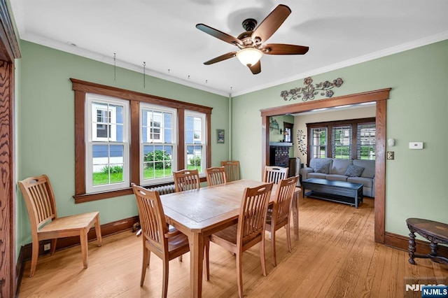 74 Bartholdi Ave, Butler Borough, NJ 07405 - dining room with light wood-style flooring, ceiling fan, and crown molding