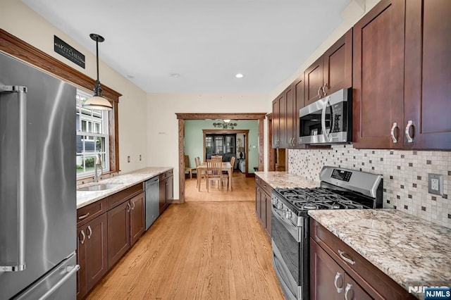 74 Bartholdi Ave, Butler Borough, NJ 07405 - kitchen featuring stainless steel appliances, light wood finished floors, decorative backsplash, light stone counters, and recessed lighting