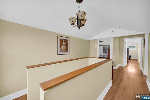 74 Bartholdi Ave, Butler Borough, NJ 07405 - hall with vaulted ceiling, light wood-style floors, and a chandelier