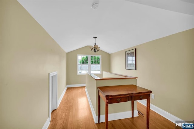 74 Bartholdi Ave, Butler Borough, NJ 07405 - hall with a chandelier, light wood-style flooring, and vaulted ceiling