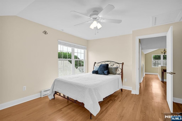 74 Bartholdi Ave, Butler Borough, NJ 07405 - bedroom featuring light wood-type flooring, lofted ceiling, a baseboard radiator, and ceiling fan